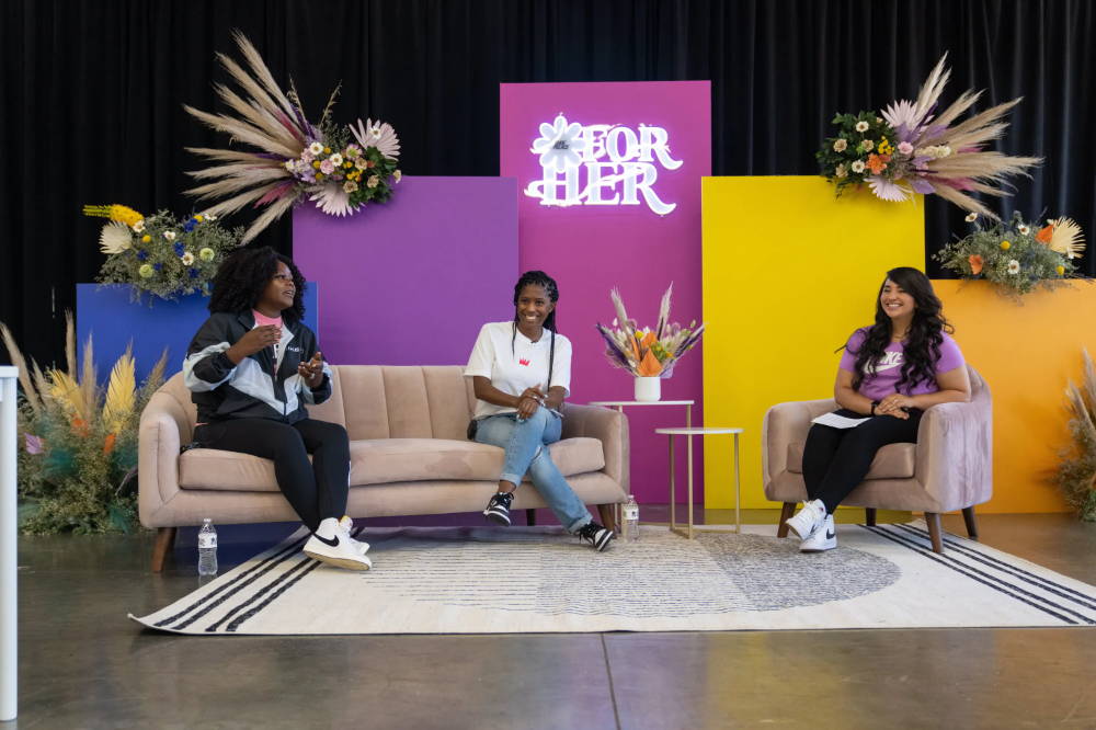 speaker and two hosts at for her event