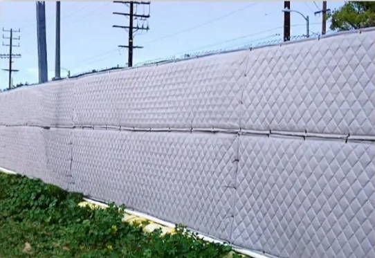 sound blankets on an exterior fence