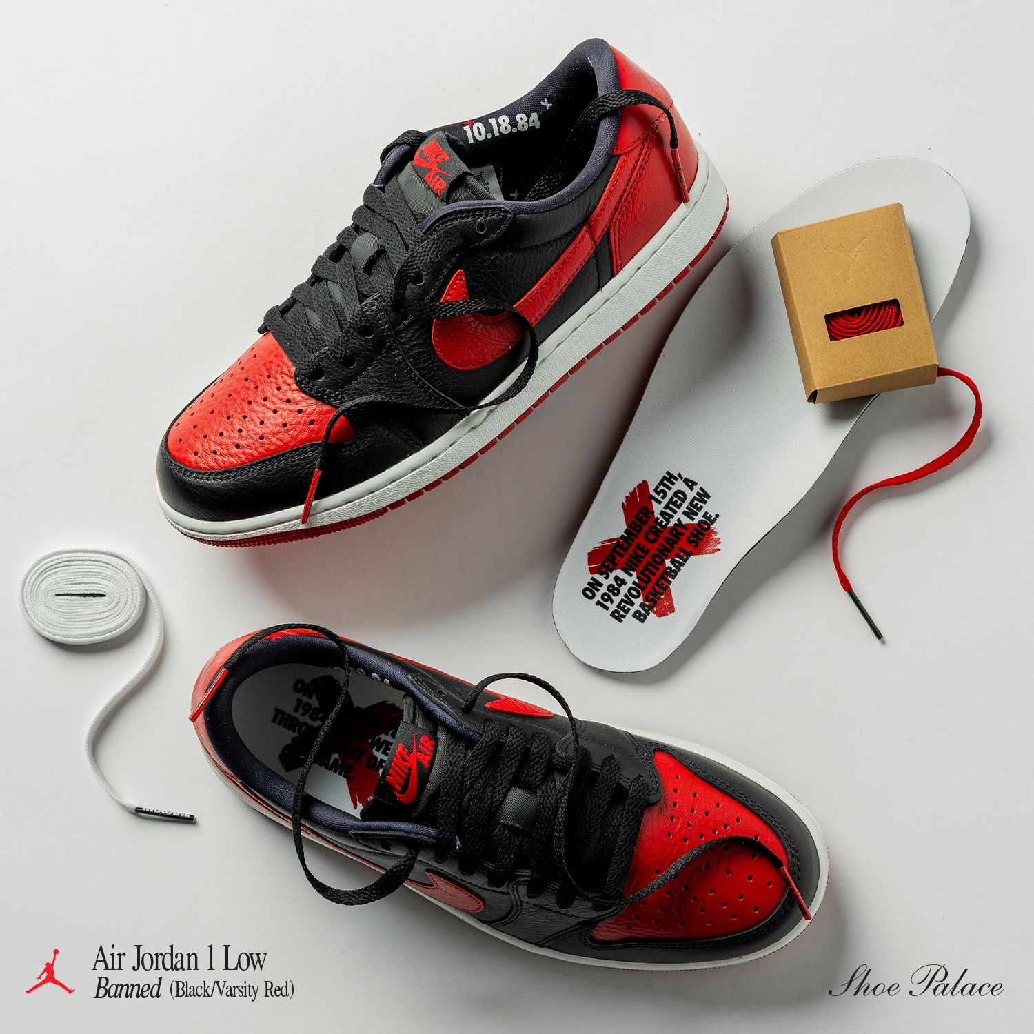 Air Jordan 1 Low Sneakers in red and black with accessories.