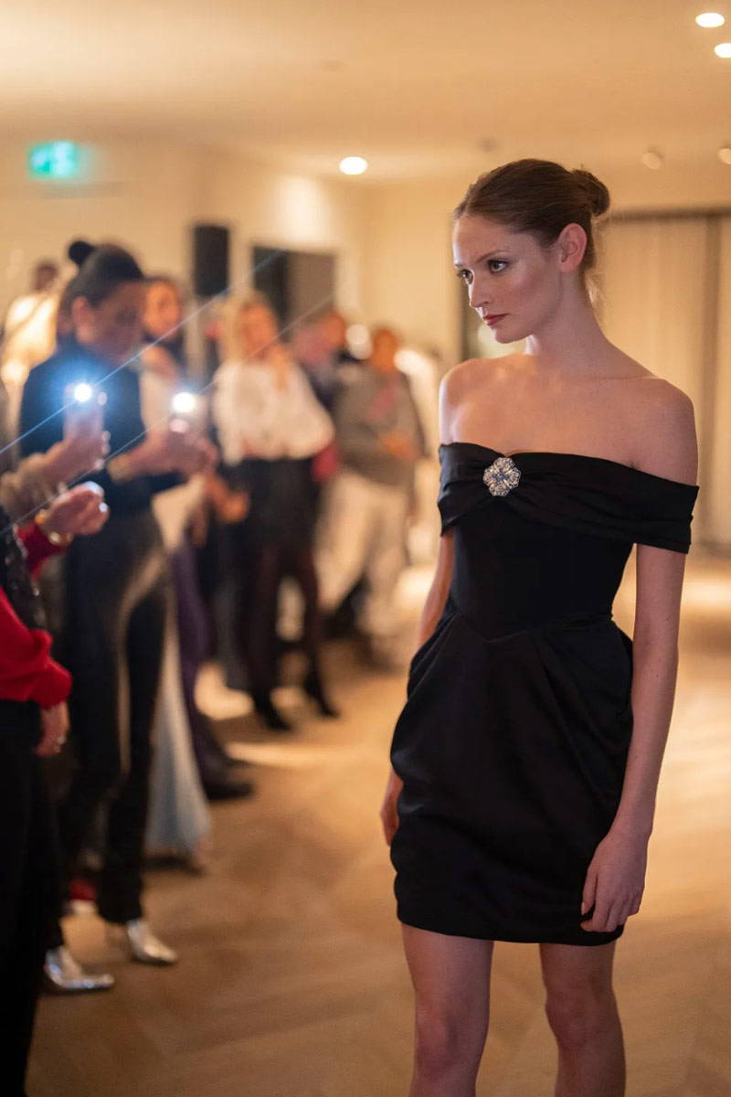 Jimmy Choo The Atelier runway with model in black evening dress