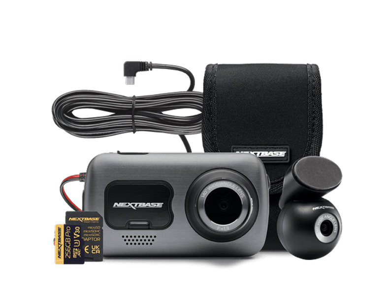 Camera with accessories including a cable, case, and memory card.