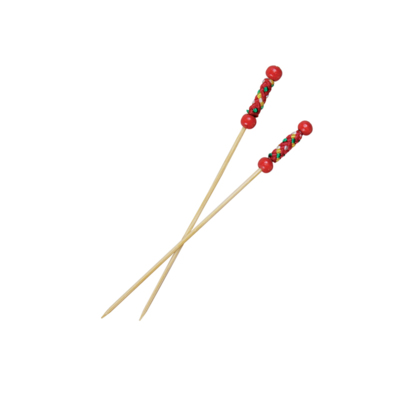 Two bamboo skewers with red beads and a red cloth section