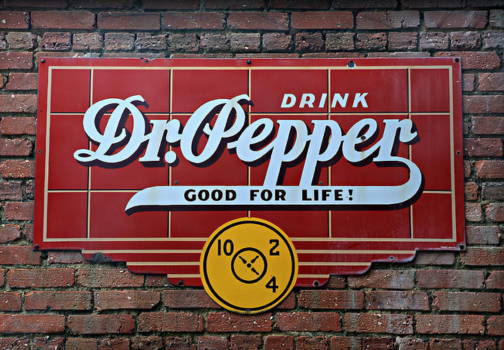 10-2-4 Dr Pepper sign on a brick wall