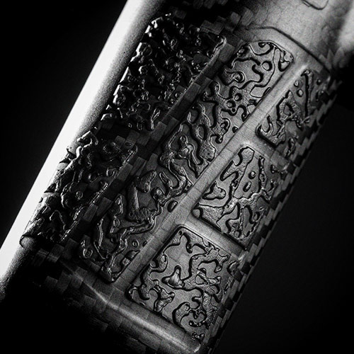 Close-up of textured black surface with intricate patterns.