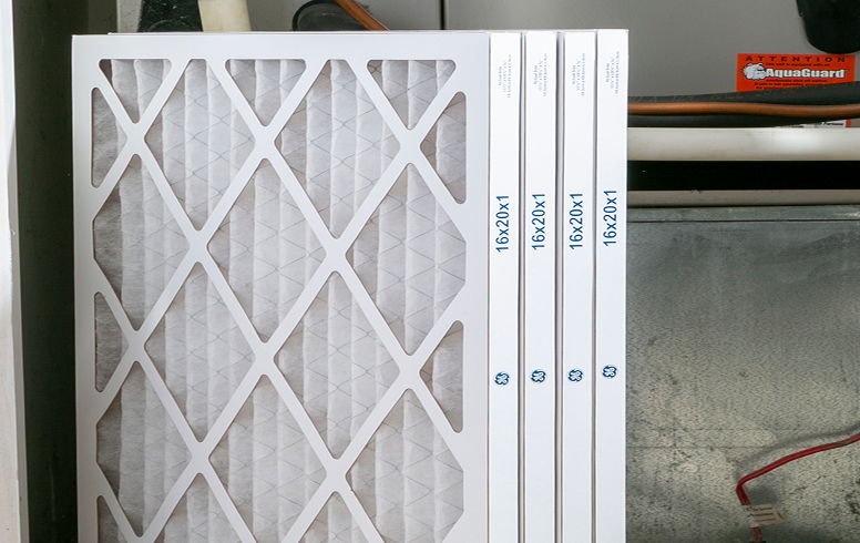 Air filters stacked in a storage area.