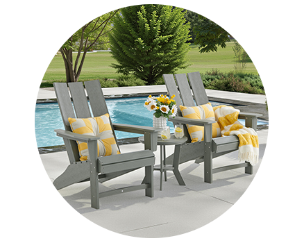 A light gray Adirondack chair on a white background.