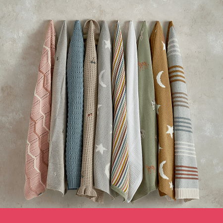 A collection of colorful ties arranged in a row.