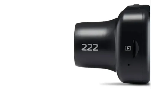 Close-up of a black camera lens with the number 222.