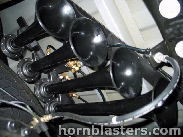 Four black train horns staggered mounting bracket brass elbow fittings spare tire undercarriage Lance's 1999 Toyota Tundra Shocker XL gallery photo 3