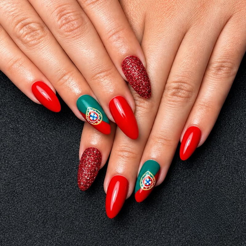 Nail art featuring red and green colors with decorative patterns.