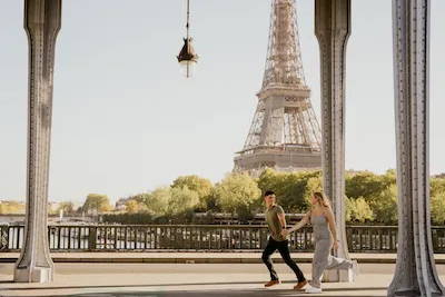 engaged couple in front of eiffel tower