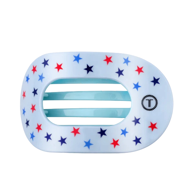 A decorative star-patterned hair clip with blue and red stars.