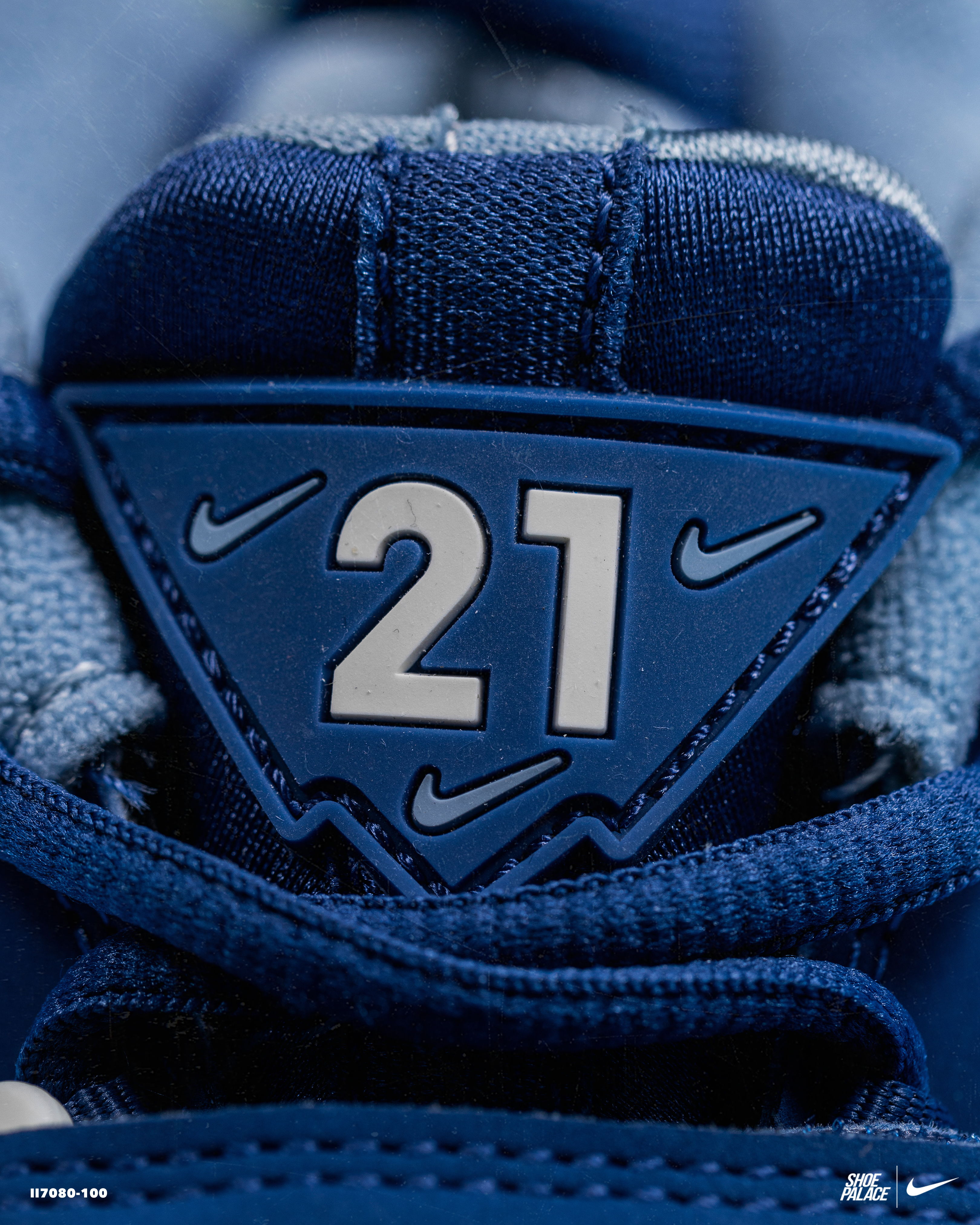 Nike shoe tag with the number 21 in a blue triangle.