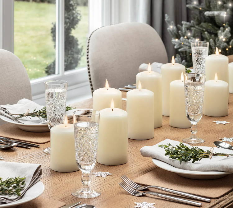 TruGlow led pillar candles laid out across a Christmas table