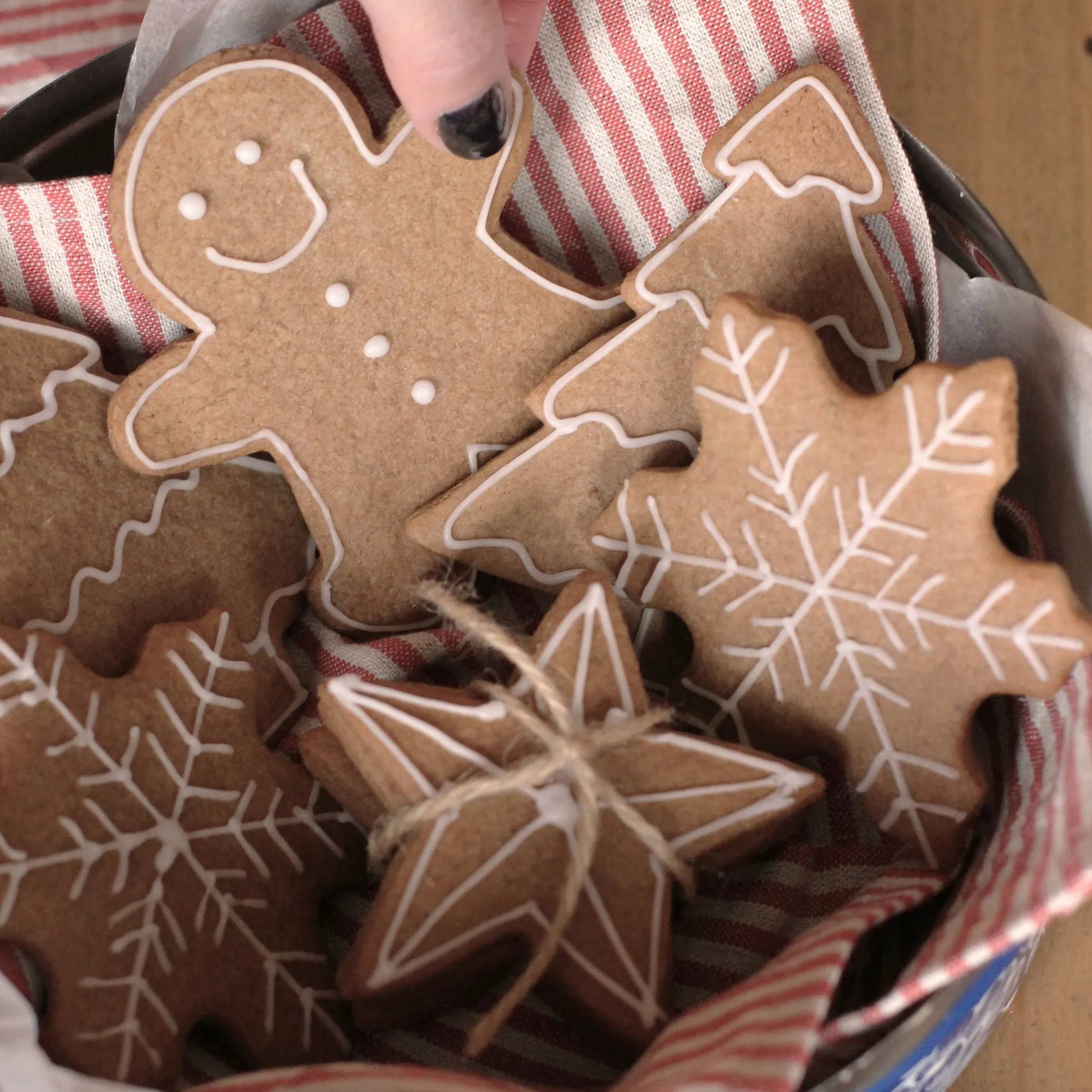 Stacks of Christmas biscuits in a tin