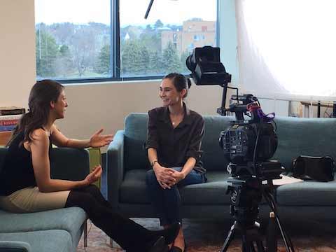 two girls talking while being filmed - AnimalBiome