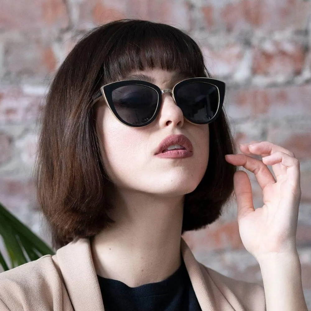 Woman with Round Face Shape wearing Willow, Cat-Eye Bamboo Wood Sunglasses