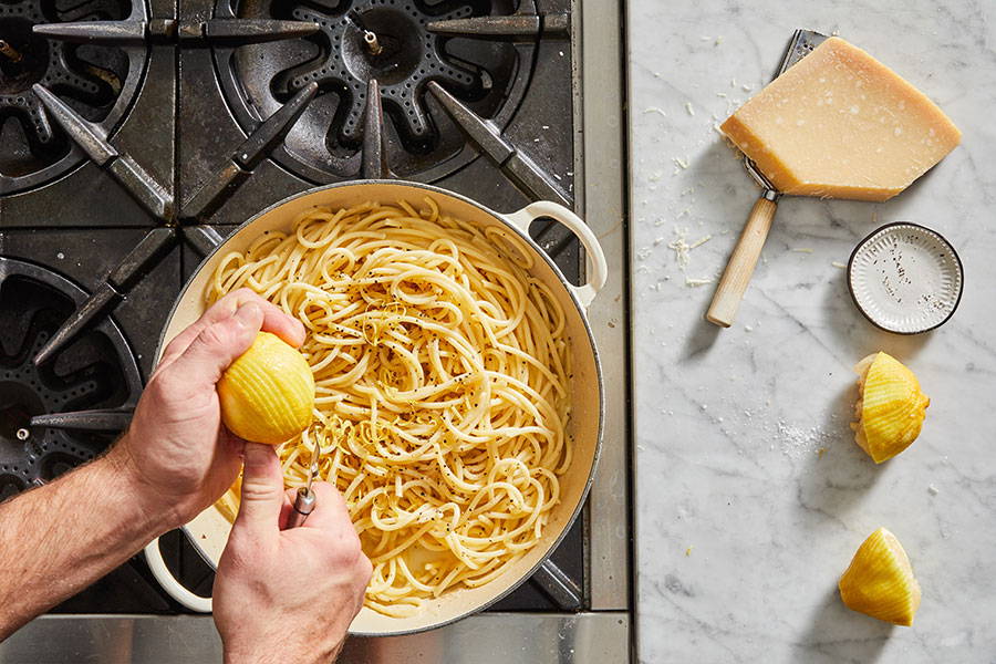 Serve the pasta topped with lemon peel strips and a pinch of black pepper.