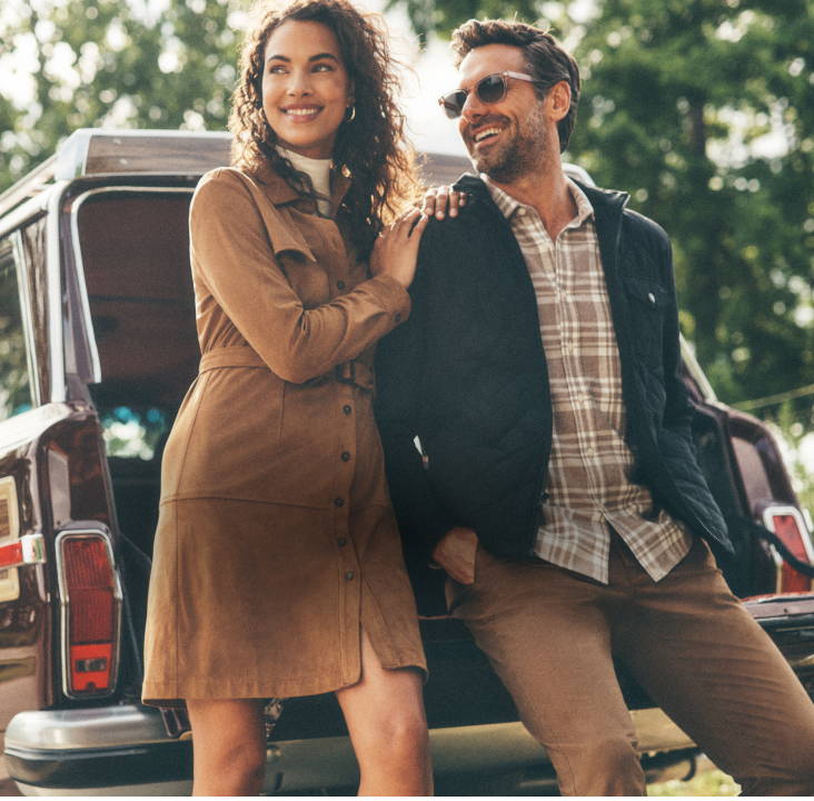 Male model is wearing the UNTUCKit Morenillo flannel with the Marty jacket. Woman model is wearing the talia dress. 