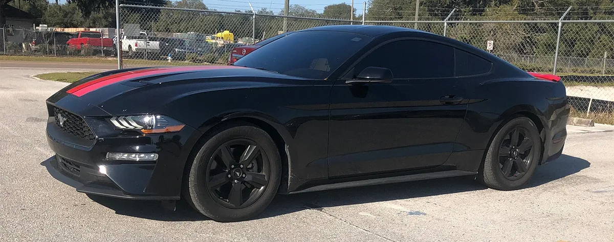 Exterior three-quarter view of Justin's 2018 Ford Mustang Ecoboost with HornBlasters Conductor's Special 244 Nightmare Edition train horn kit featured customer install gallery photo 1