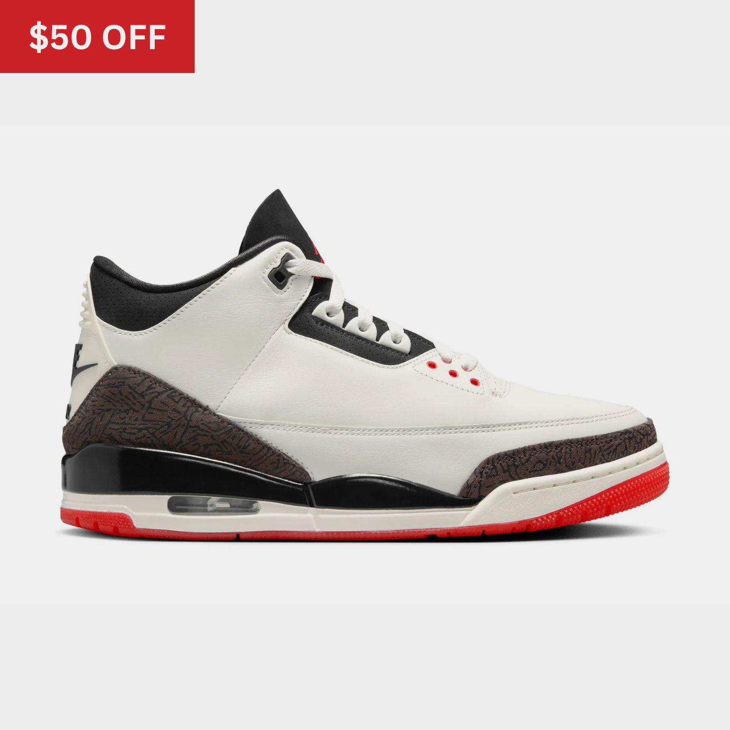 White and black sneakers with red accents, featuring a 