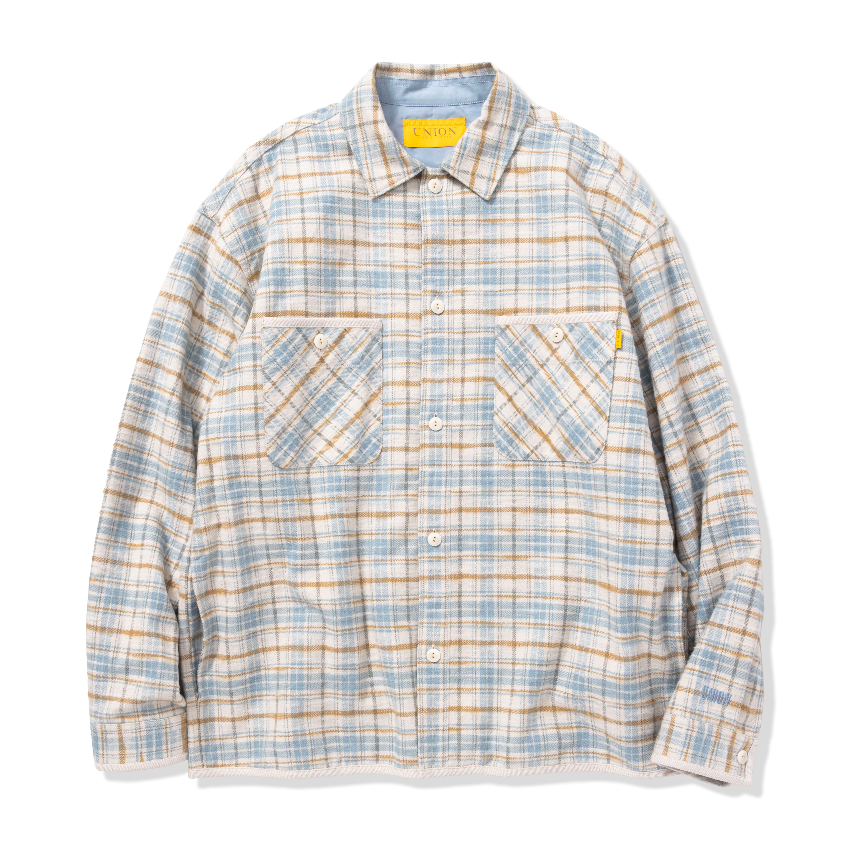 A long-sleeve plaid shirt with two chest pockets.