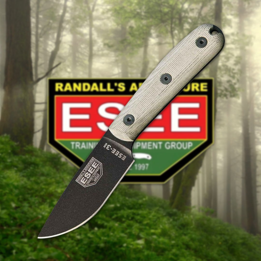 Knife with a grey handle in a forest background.