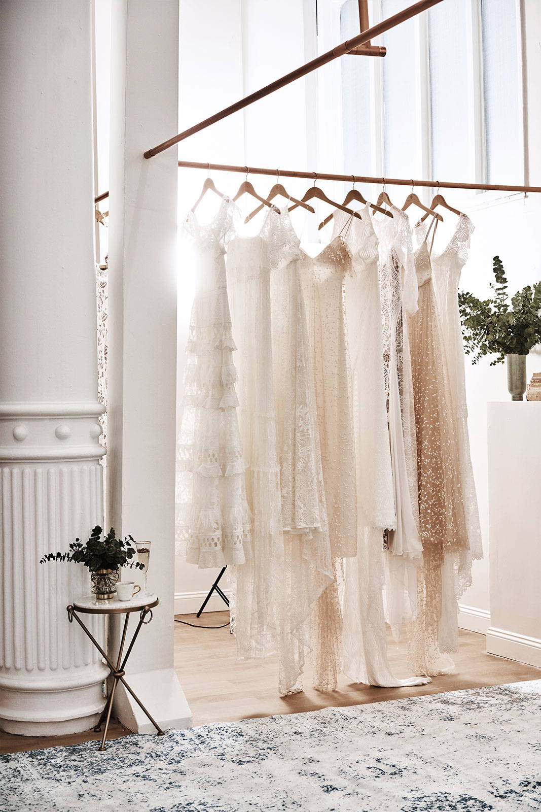 Grace Loves Lace gowns hanging on rack