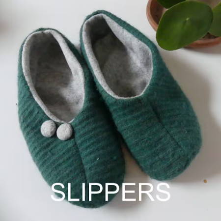 Slippers made out of a green sweater and gray fleece fabric