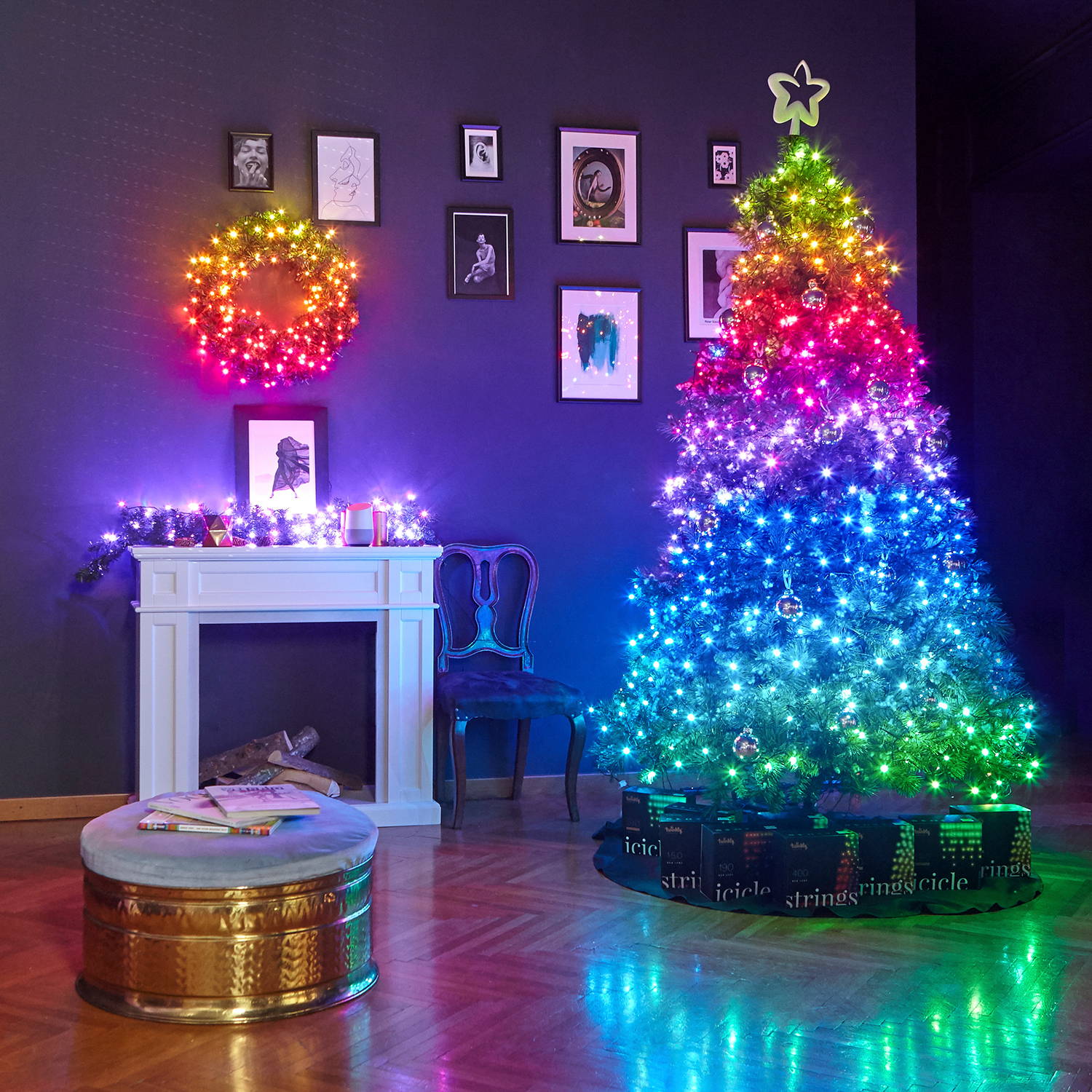 Multi coloured Twinkly lights adorning Christmas tree, wreath and garland in living room