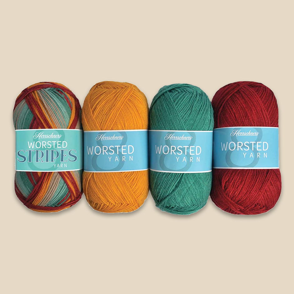 Four yarn skeins of Herrschners Worsted Stripes in various colors with labels.