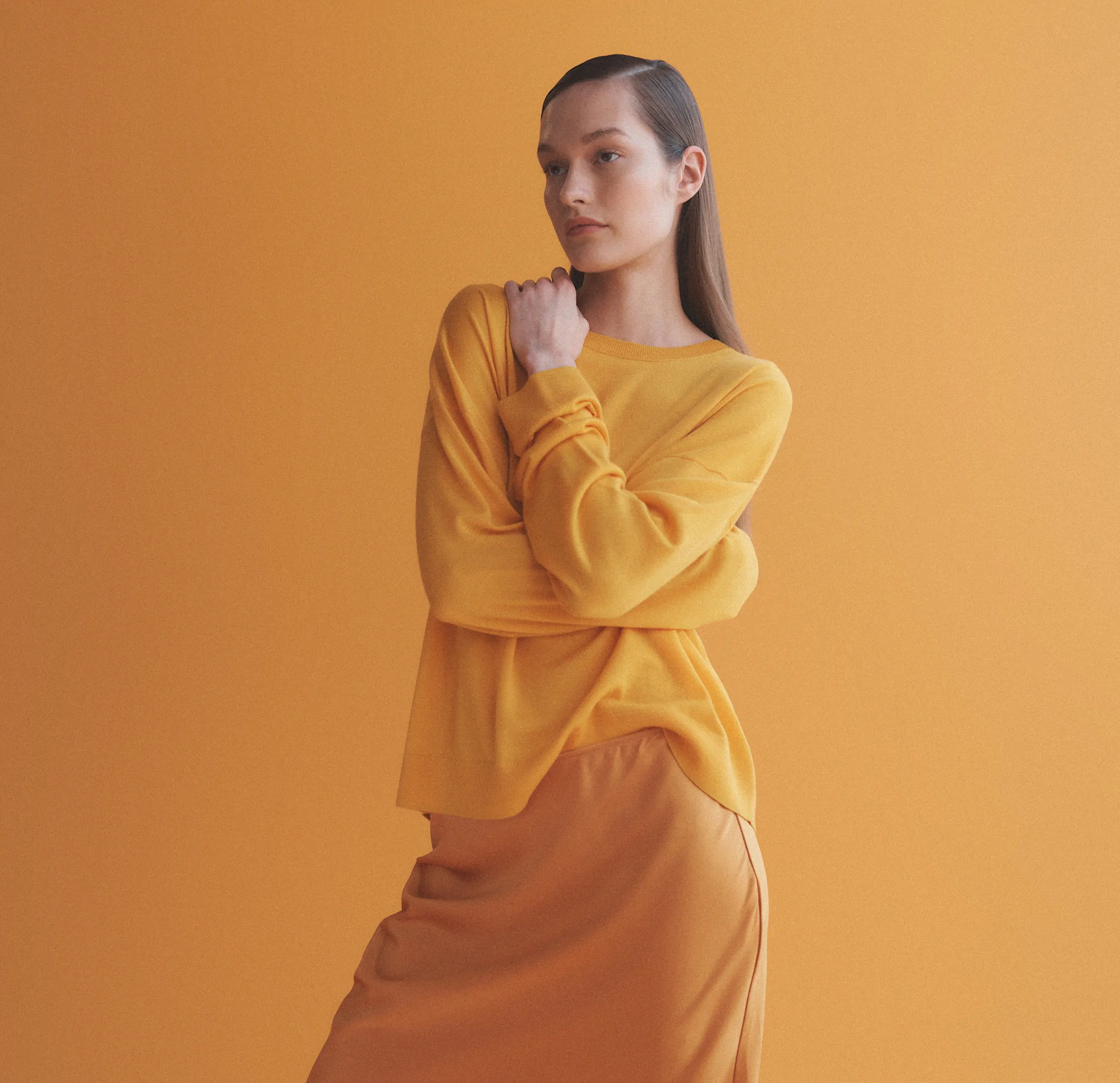 woman with arms wrapped around herself
