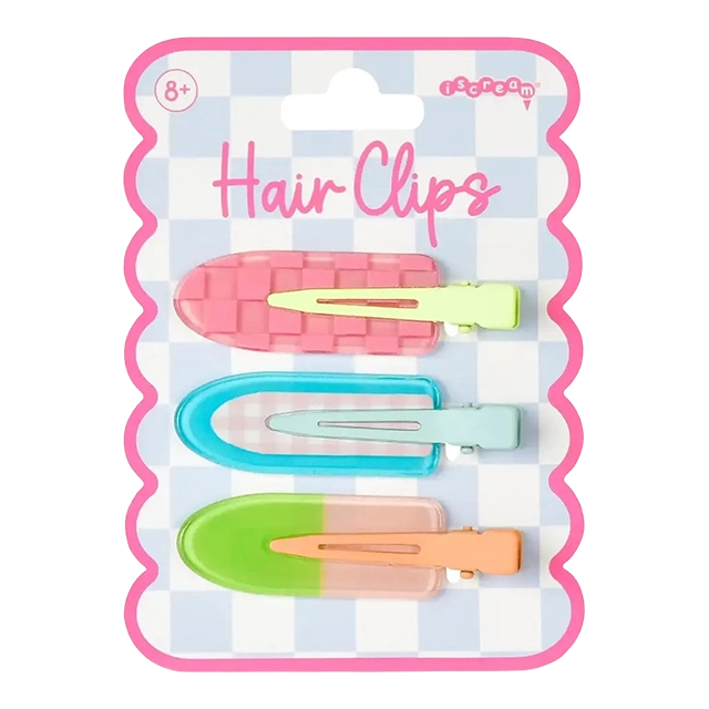 Three colorful hair clips on a patterned card.