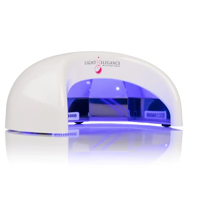 A white UV nail lamp with blue light inside.