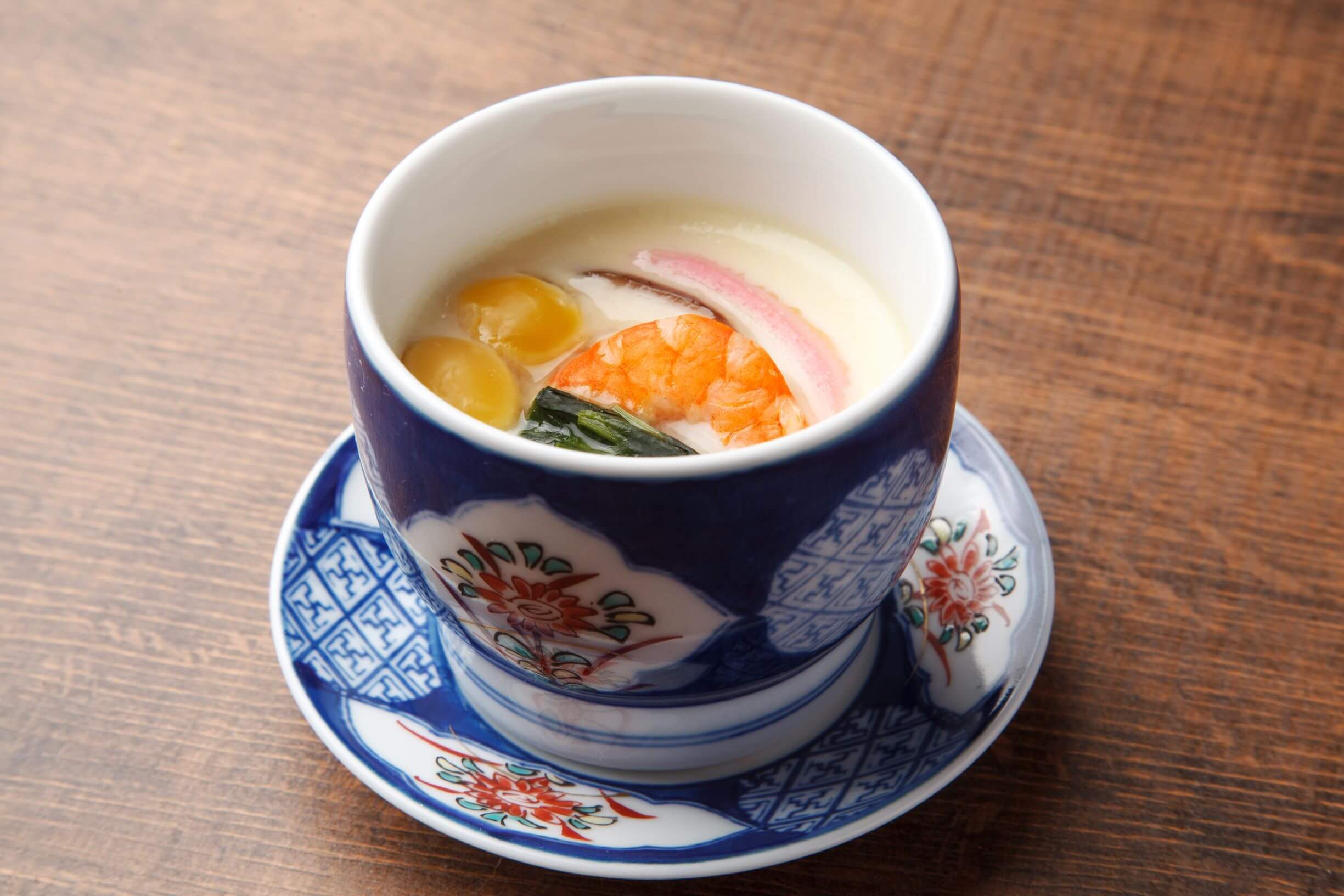 A tea cup filled with steamed egg