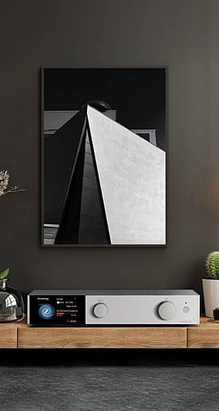 Modern interior featuring abstract wall art and a sleek audio system.