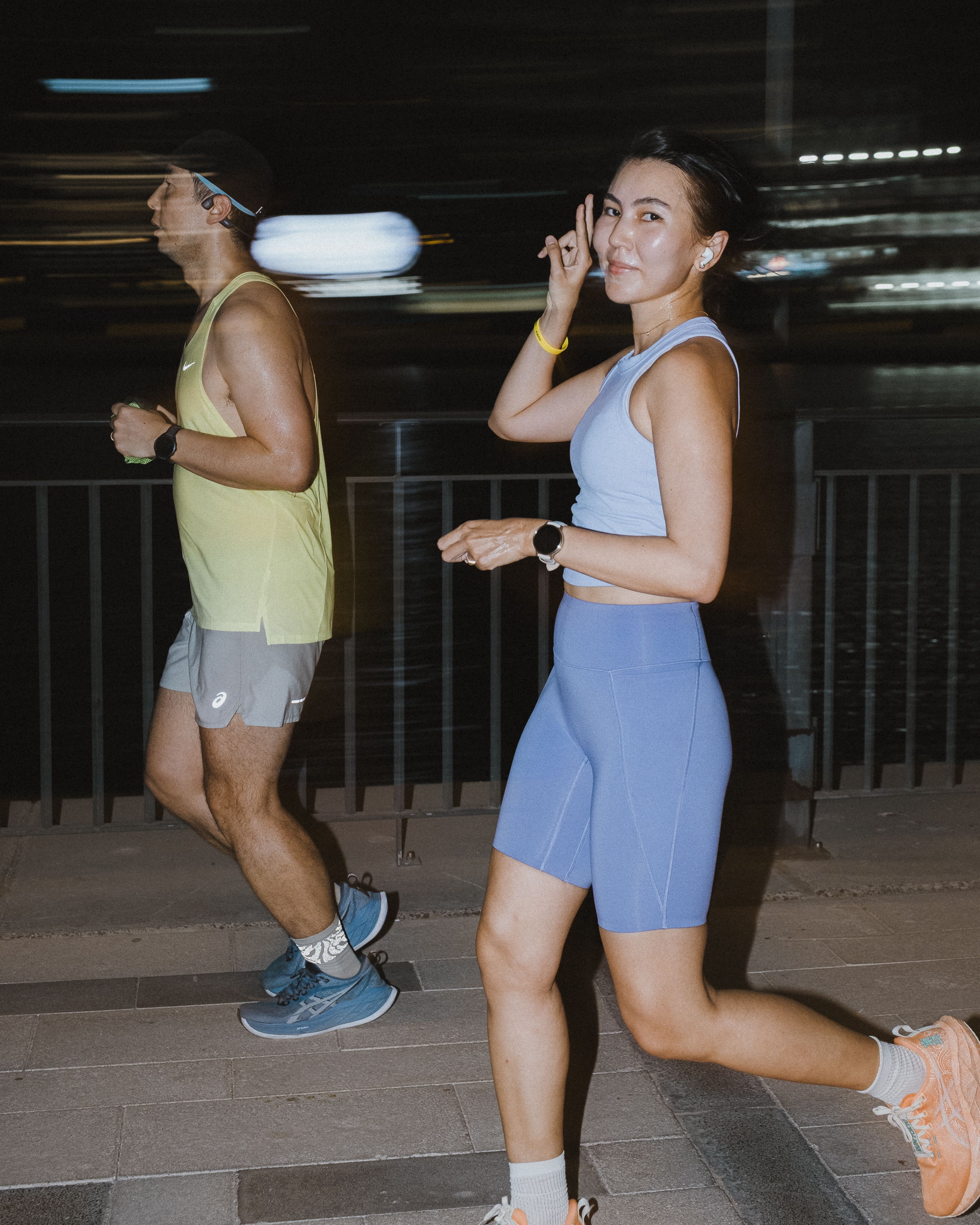 Runners enjoying a community run along the Dubai Canal during Global Running Day with ASICS and FRAME RUN CLUB in Dubai Design District.