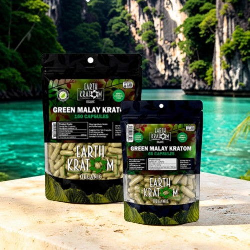 Two packages of Green Malay Kratom on a stone by water.