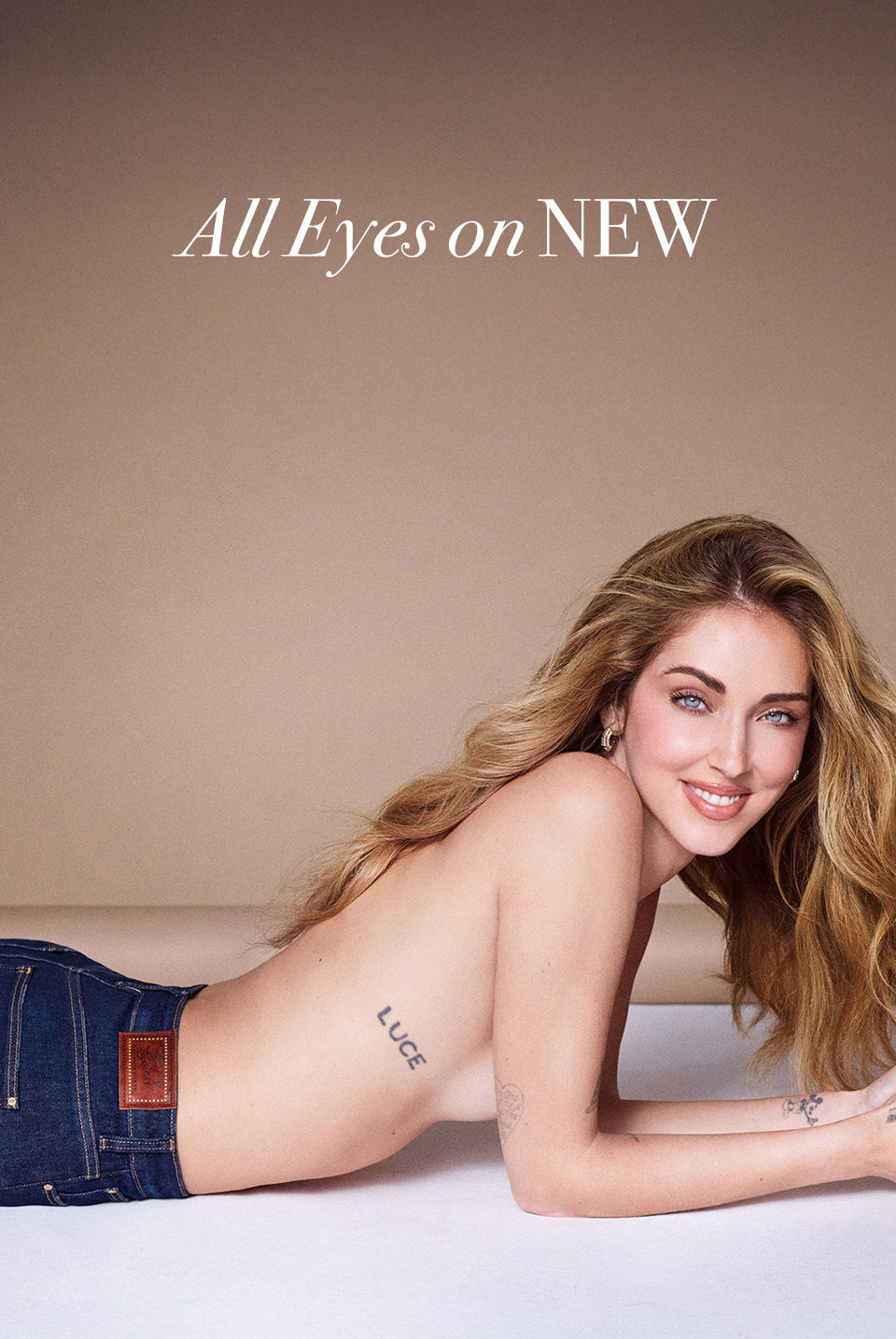 Chiara Ferragni lying down, showcasing denim jeans, with the text 