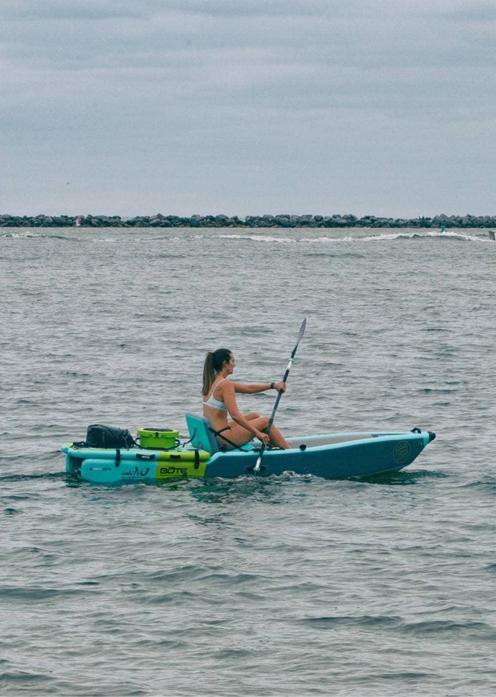 Woman paddling her LONO Aero