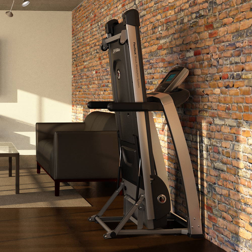 A treadmill in a living room with a brick wall