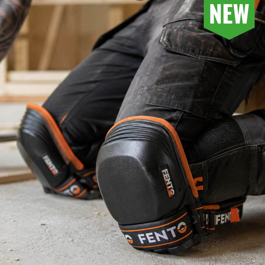 Kneepads worn on a worker's knees in a construction setting.