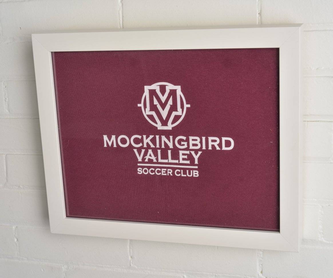 Mockingbird Valley Soccer Club  tee shirt framed and displayed in Shart Preium White T-Shirt Frame