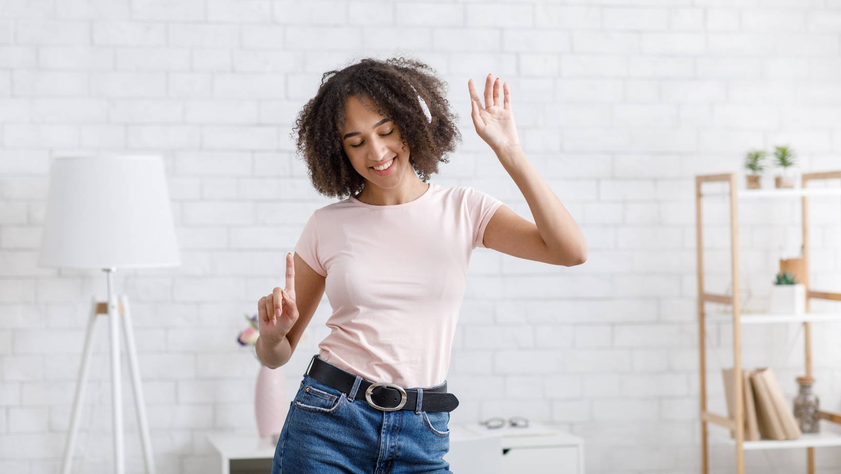 woman dancing with headphones on