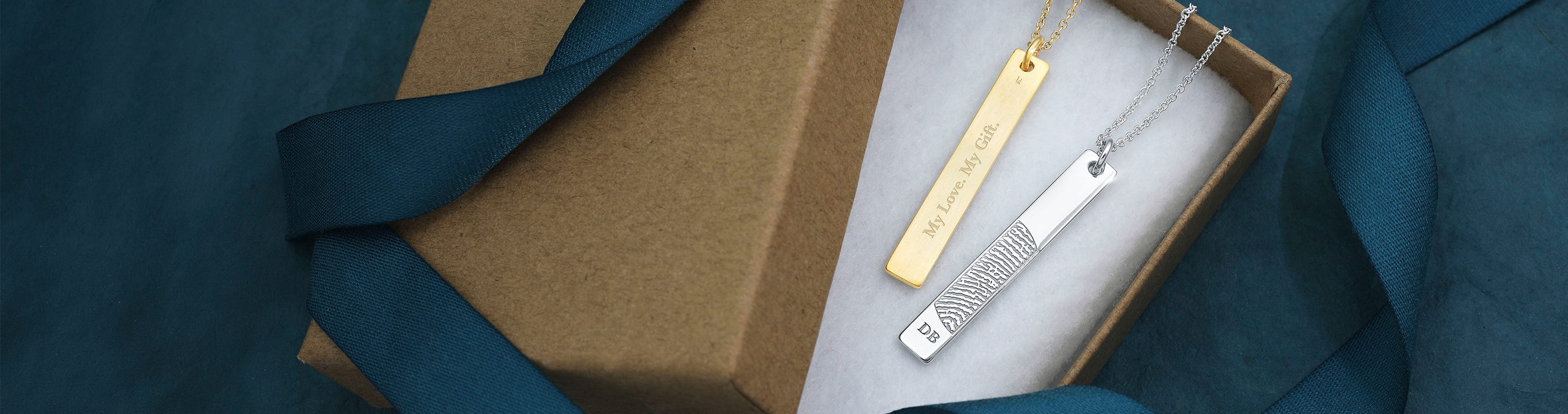 vertical bar pendants engraved with a fingerprint
