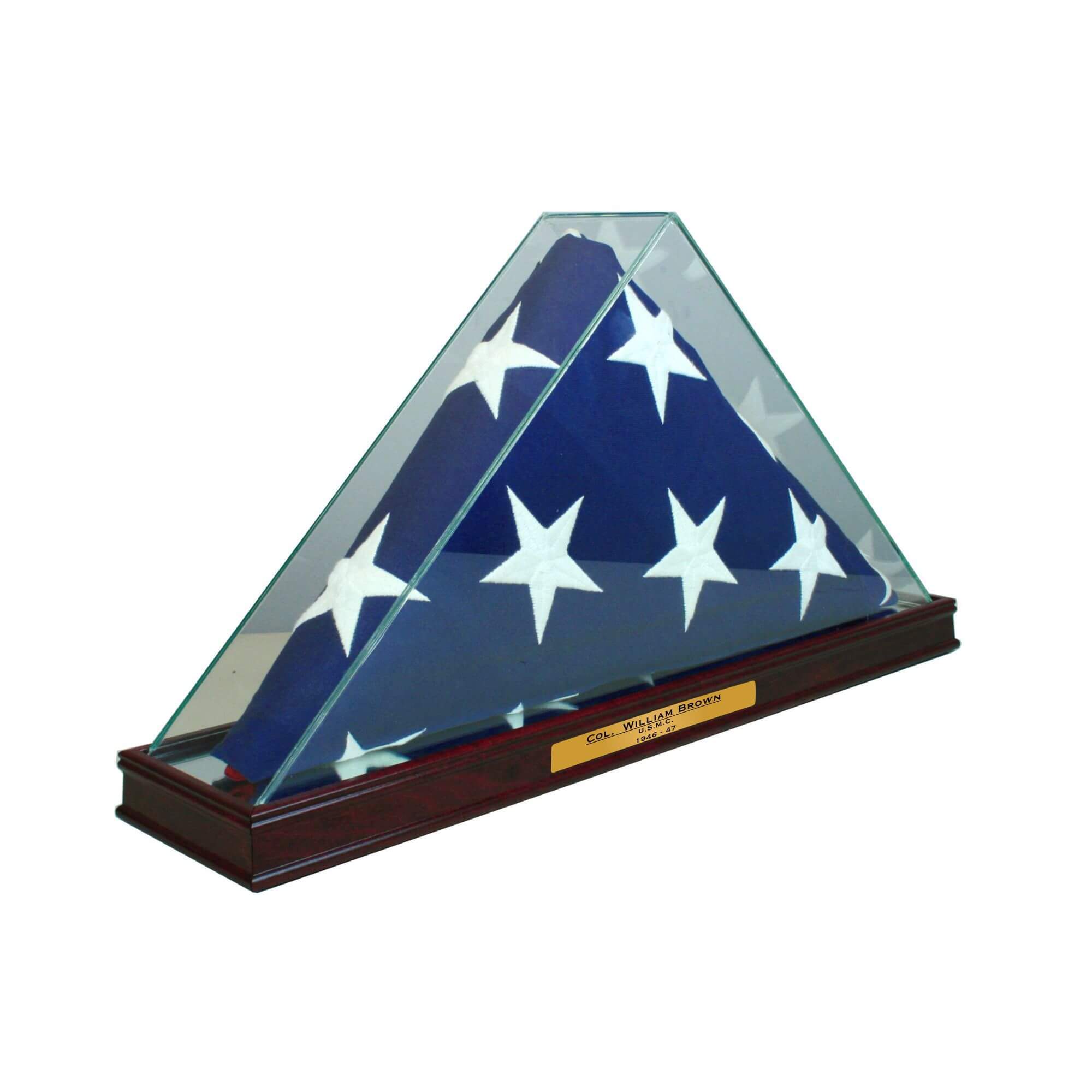 American flag displayed in a glass case on a wooden base.
