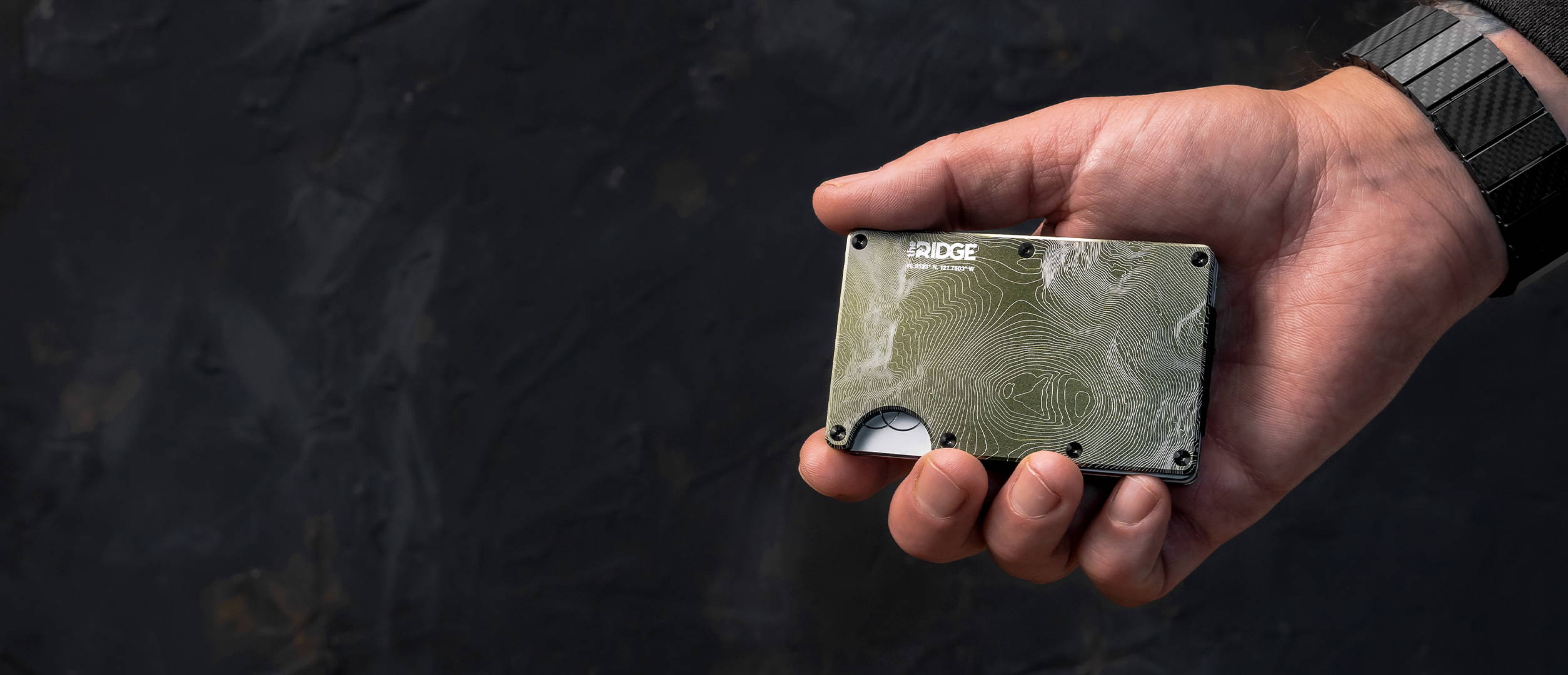 holding a Mount Rainier Ridge wallet