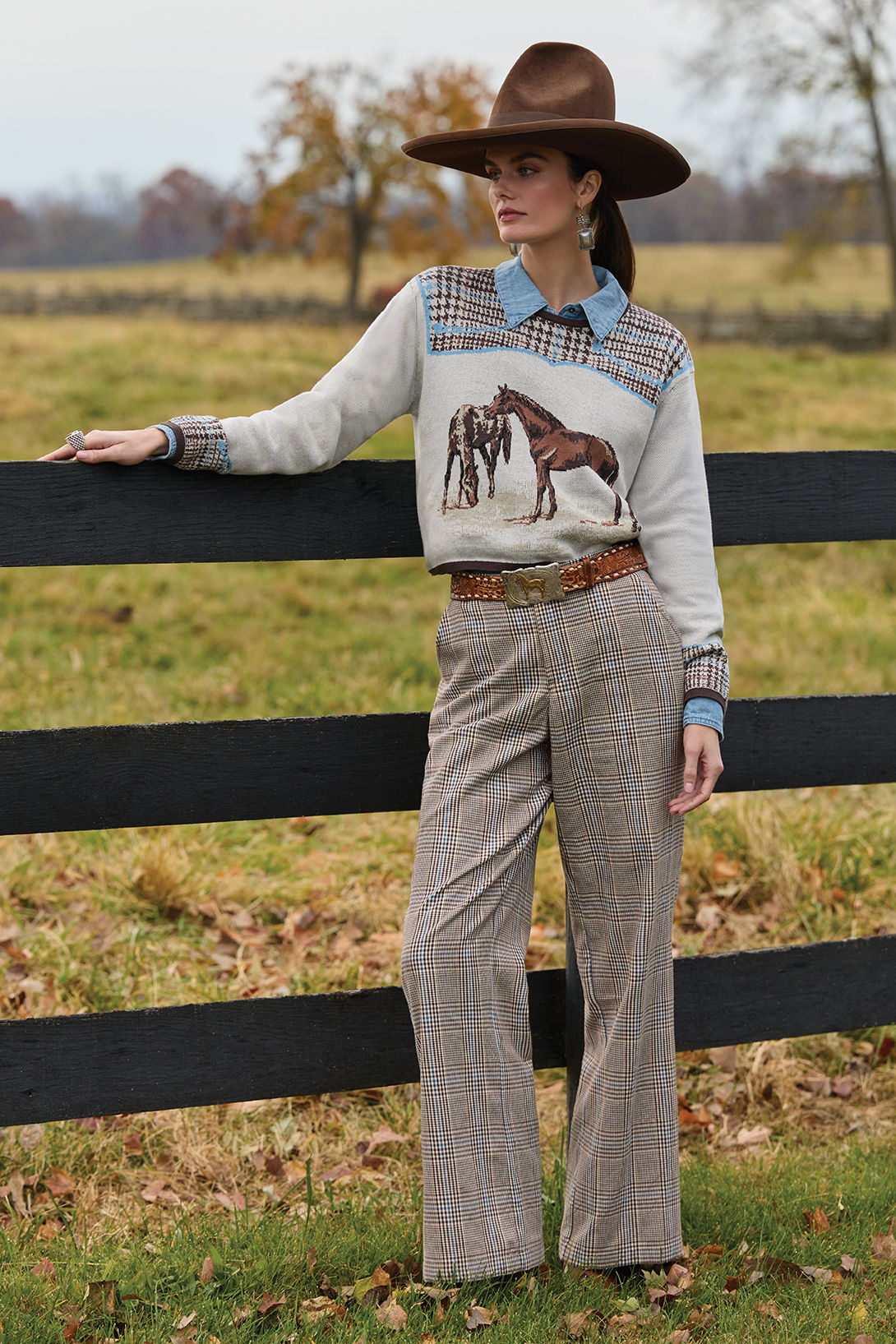 Kaylin wearing the Horsiculture Sweater paired together with the Buckskin Blue Top and Riding Habit Pant. 