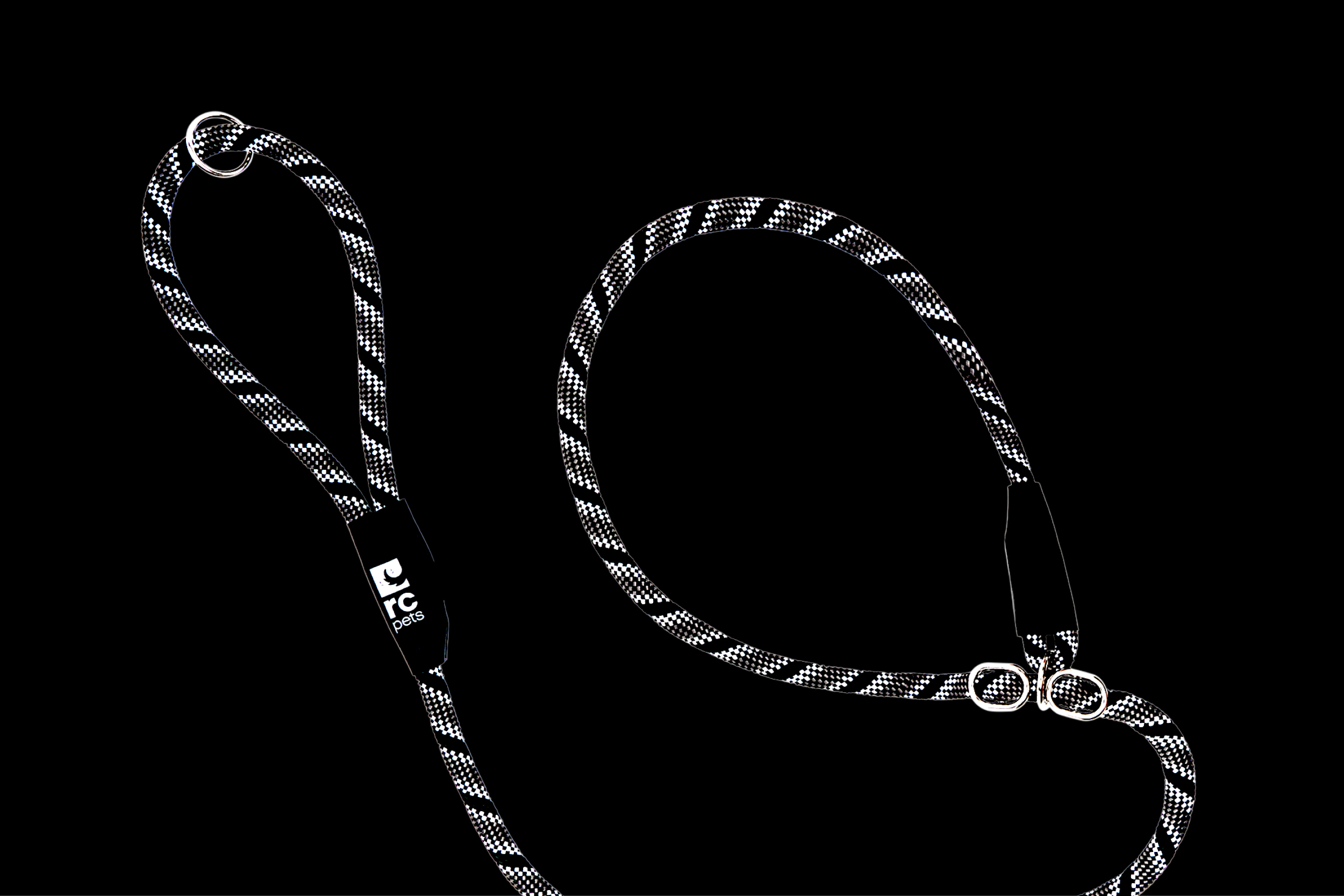 Black and white rope leash with metal clips on a black background.