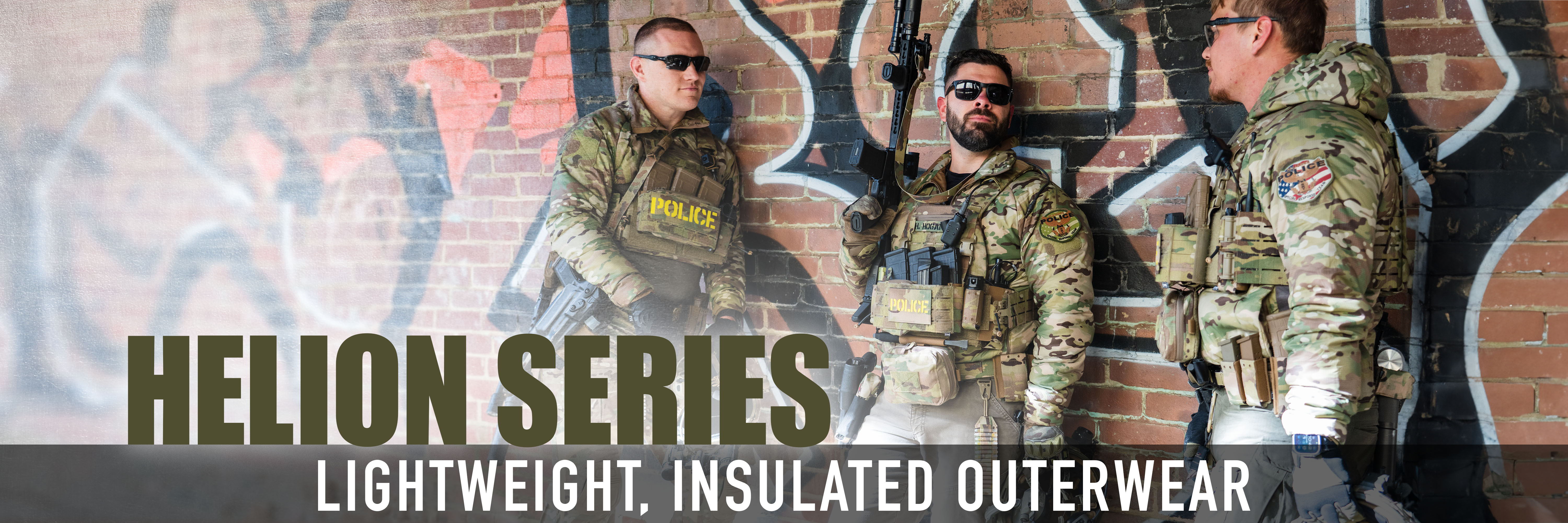 Models showcasing Helion Series lightweight insulated outerwear against a graffiti background.